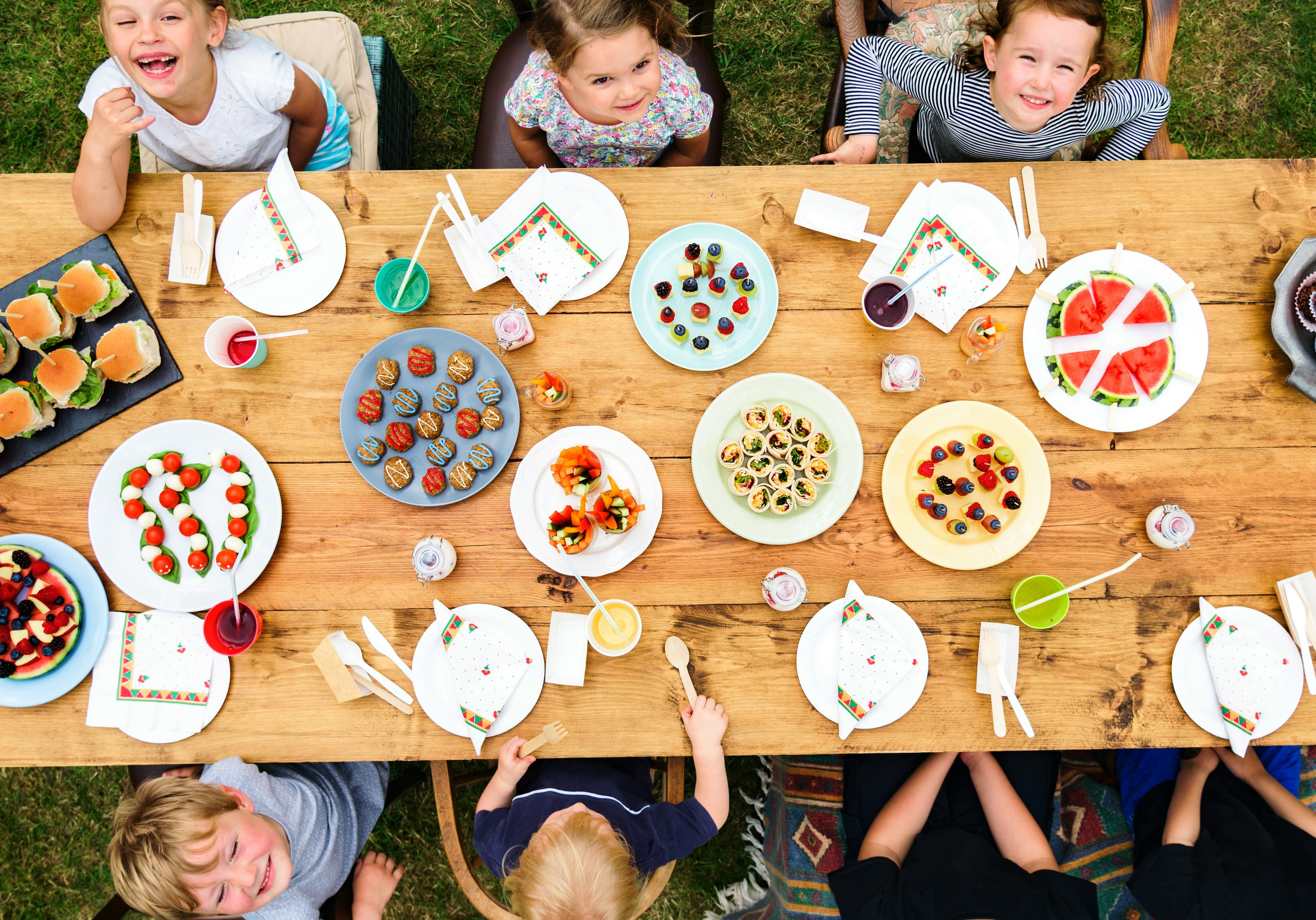 Garden party food arranged on a decorated outdoor table