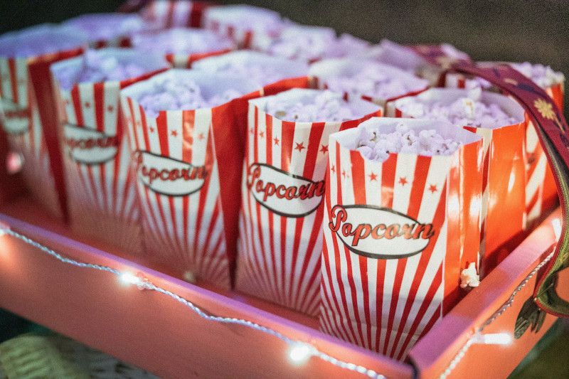 Colorful popcorn cups with sweet mix for a kids party