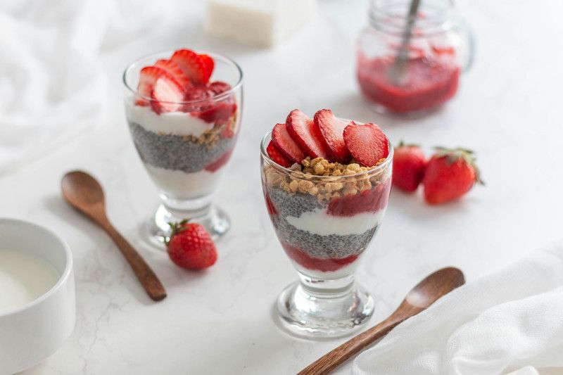 Mini yogurt jars with fruit and granola at a birthday party