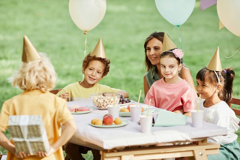 Family smiling and celebrating a child’s birthday